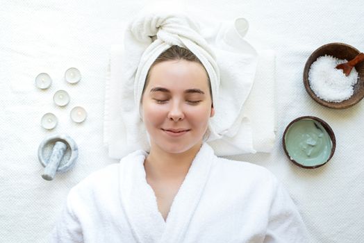 Spa and wellness. Natural cosmetics. Self care. Top view of a relaxed woman having spa procedures using natural cosmetics