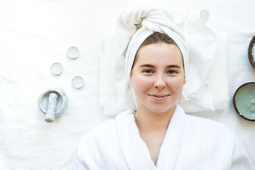 Spa and wellness. Natural cosmetics. Self care. Top view of a relaxed woman having spa procedures using natural cosmetics