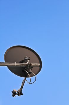 Satelite bowl with blue sky in the background.