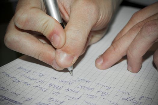 Write texts on a sheet of paper. Pen in hand. Leherheide, Bremerhaven, Germany.