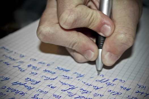 Write texts on a sheet of paper. Pen in hand. Leherheide, Bremerhaven, Germany.