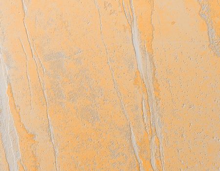 Grungy stone texture background. Abstract yellow background.