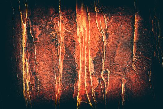 Dark Halloween background with copy space. Red stone surface close up. Abstract textured background