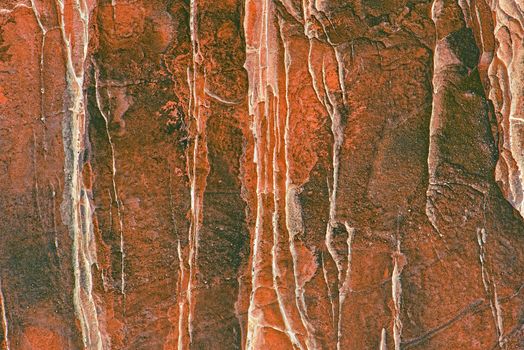 White and red background. Stone surface close up.