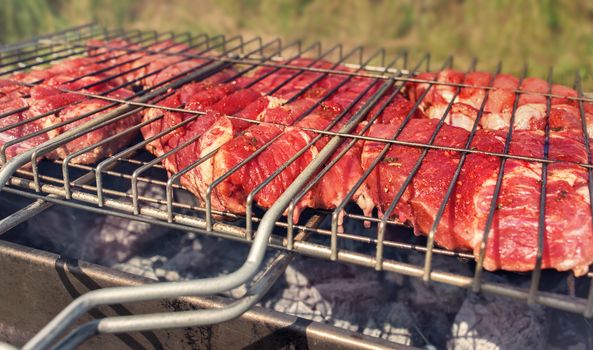 Beef grilled steak. Cooking meat on grill