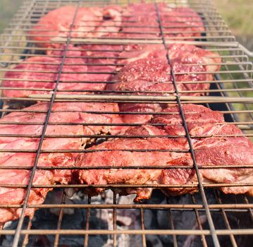 Beef grilled steak. Cooking meat on grill