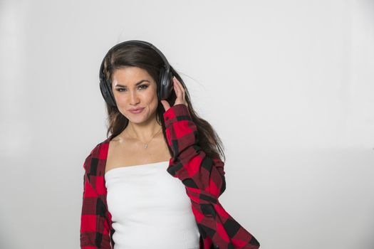 A gorgeous brunette model posing in a studio environment