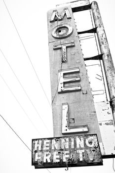 Old Motel sign ruin along historic Route 66 in the middle of California vast Mojave desert.