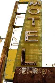 Old Motel sign ruin along historic Route 66 in the middle of California vast Mojave desert.