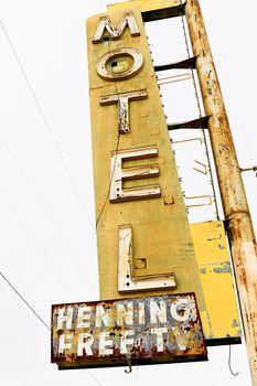 Old Motel sign ruin along historic Route 66 in the middle of California vast Mojave desert.