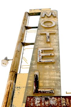 Old Motel sign ruin along historic Route 66 in the middle of California vast Mojave desert.