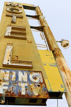 Old Motel sign ruin along historic Route 66 in the middle of California vast Mojave desert.