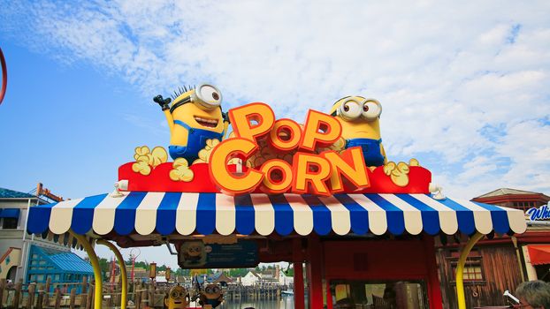 OSAKA, JAPAN - APR 21, 2017 : Photo of "HAPPY MINION POP CORN SHOP", selling Minion Pop Corn, located in Universal Studios, Osaka, Japan. Minions are famous character from Despicable Me animation.