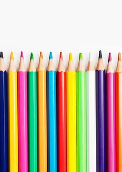 Close up of color pencils on white background. Back to school concept