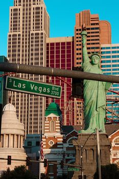 Road sign of Las Vegas BLVD.Street sign of Las vegas Boulevard.Green Las Vegas Sign with Hotel in Background.