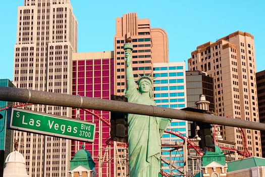 Road sign of Las Vegas BLVD.Street sign of Las vegas Boulevard.Green Las Vegas Sign with Hotel in Background.