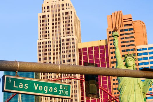 Road sign of Las Vegas BLVD.Street sign of Las vegas Boulevard.Green Las Vegas Sign with Hotel in Background.