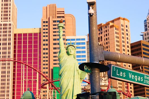 Road sign of Las Vegas BLVD.Street sign of Las vegas Boulevard.Green Las Vegas Sign with Hotel in Background.