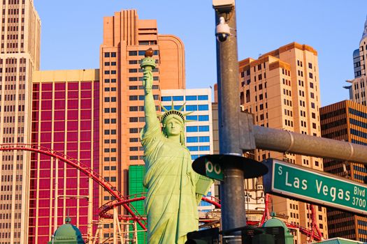 Road sign of Las Vegas BLVD.Street sign of Las vegas Boulevard.Green Las Vegas Sign with Hotel in Background.