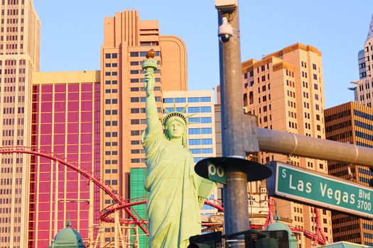 Road sign of Las Vegas BLVD.Street sign of Las vegas Boulevard.Green Las Vegas Sign with Hotel in Background.