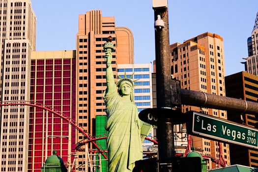 Road sign of Las Vegas BLVD.Street sign of Las vegas Boulevard.Green Las Vegas Sign with Hotel in Background.