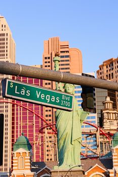 Road sign of Las Vegas BLVD.Street sign of Las vegas Boulevard.Green Las Vegas Sign with Hotel in Background.