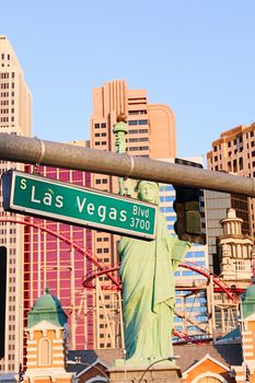 Road sign of Las Vegas BLVD.Street sign of Las vegas Boulevard.Green Las Vegas Sign with Hotel in Background.