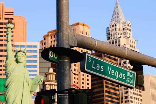 Road sign of Las Vegas BLVD.Street sign of Las vegas Boulevard.Green Las Vegas Sign with Hotel in Background.