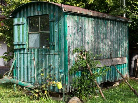 Old weathered wooden contractor's shed in the garden