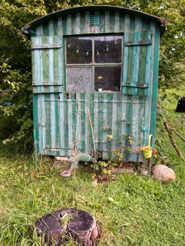 Old weathered wooden contractor's shed in the garden