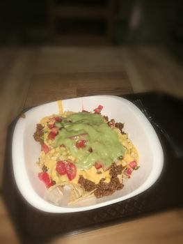 Mexican tortillas with minced meat, cheddar cheese and guacamole. High quality photo