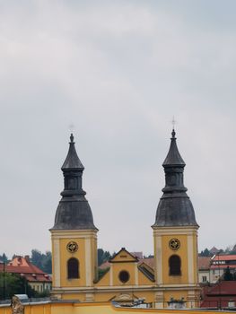 A clock tower in front of a building. High quality photo