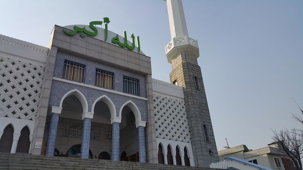 Seoul, South Korea - February 12, 2019:  Seoul Central Mosque, the first and biggest Islamic mosque in South Korea located in Itaewon Dong area. It has minerates and Letters with Allahu Akbar which means "Allah is the greatest".
