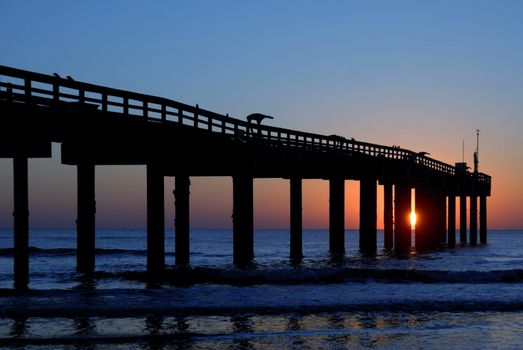 A long bridge over a body of water. High quality photo