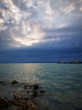 Clouds in the sky over a body of water. High quality photo