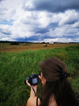 A person holding a camera. High quality photo