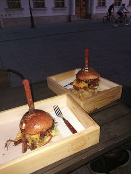 A sandwich sitting on top of a wooden table. High quality photo