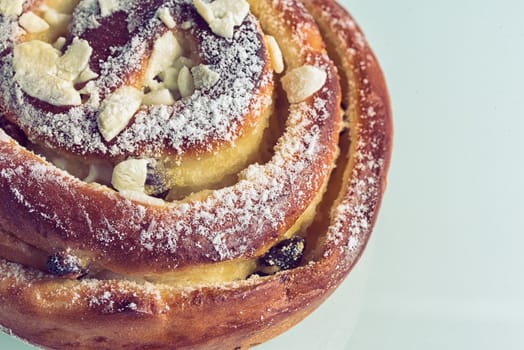 Sweet bun closeup. Fresh pastries on the table