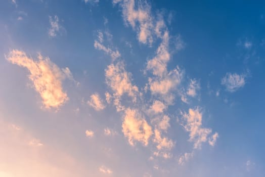 Clouds in the blue sky. Clouds at sunset