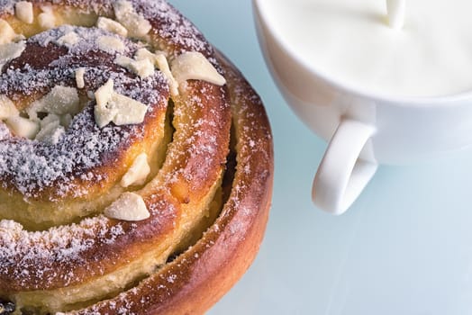 Sweet bun closeup. Fresh pastries and milk