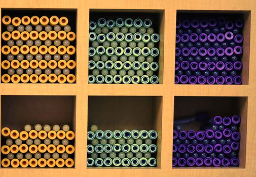 Blood collection test tubes placed on shelves. High quality photo