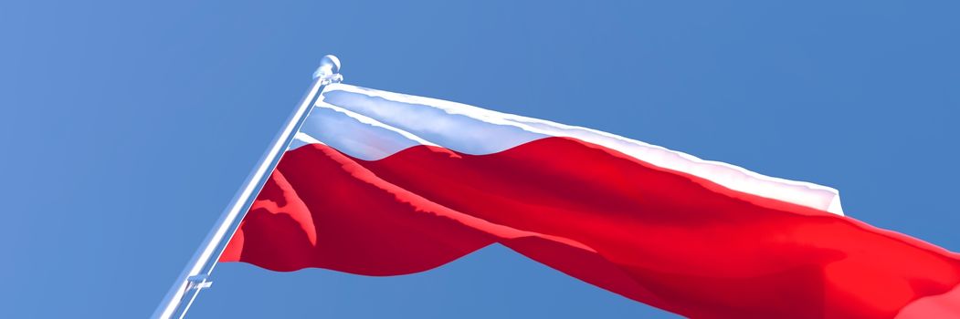 3D rendering of the national flag of Poland waving in the wind against a blue sky