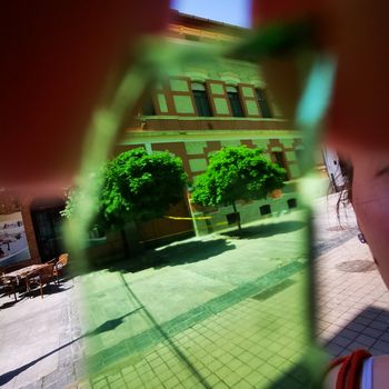 Special image of downtown Miskolc from a piece of green glass. High quality photo