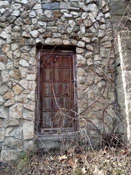 Stone building with wooden door High quality photo