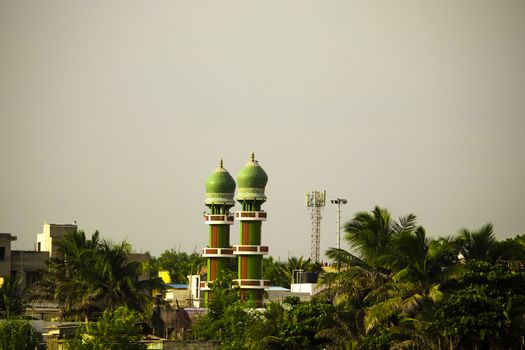 The upper two green towers of the Muslim's Holy Mosque in Chennai