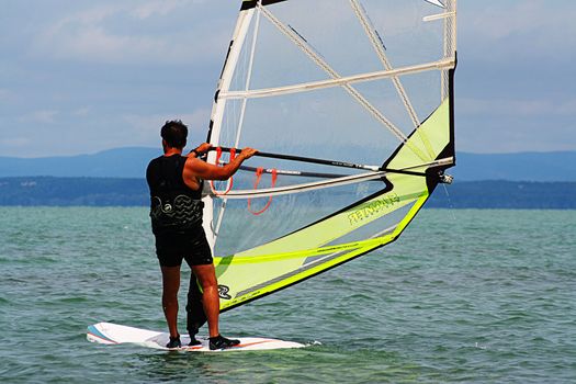 A man windsurfing at Lake Balaton. High quality photo