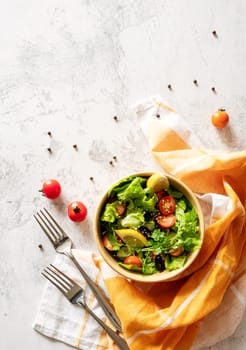 Healthy food concept. A bowl of vegetable mixed salad top view flat lay with copy space