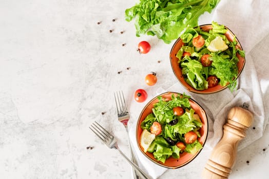 Healthy food concept. Bowls of vegetable mixed salad top view flat lay with copy space