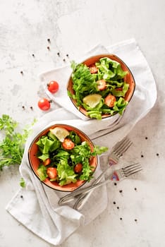 Healthy food concept. A bowl of vegetable mixed salad top view flat lay with copy space