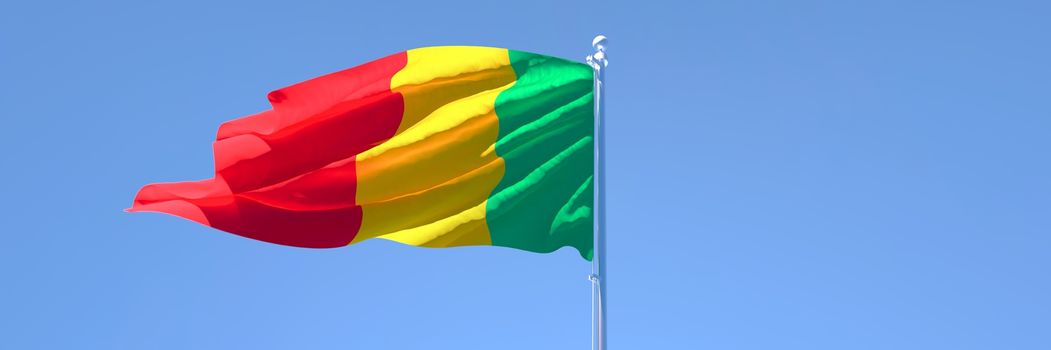 3D rendering of the national flag of Mali waving in the wind against a blue sky